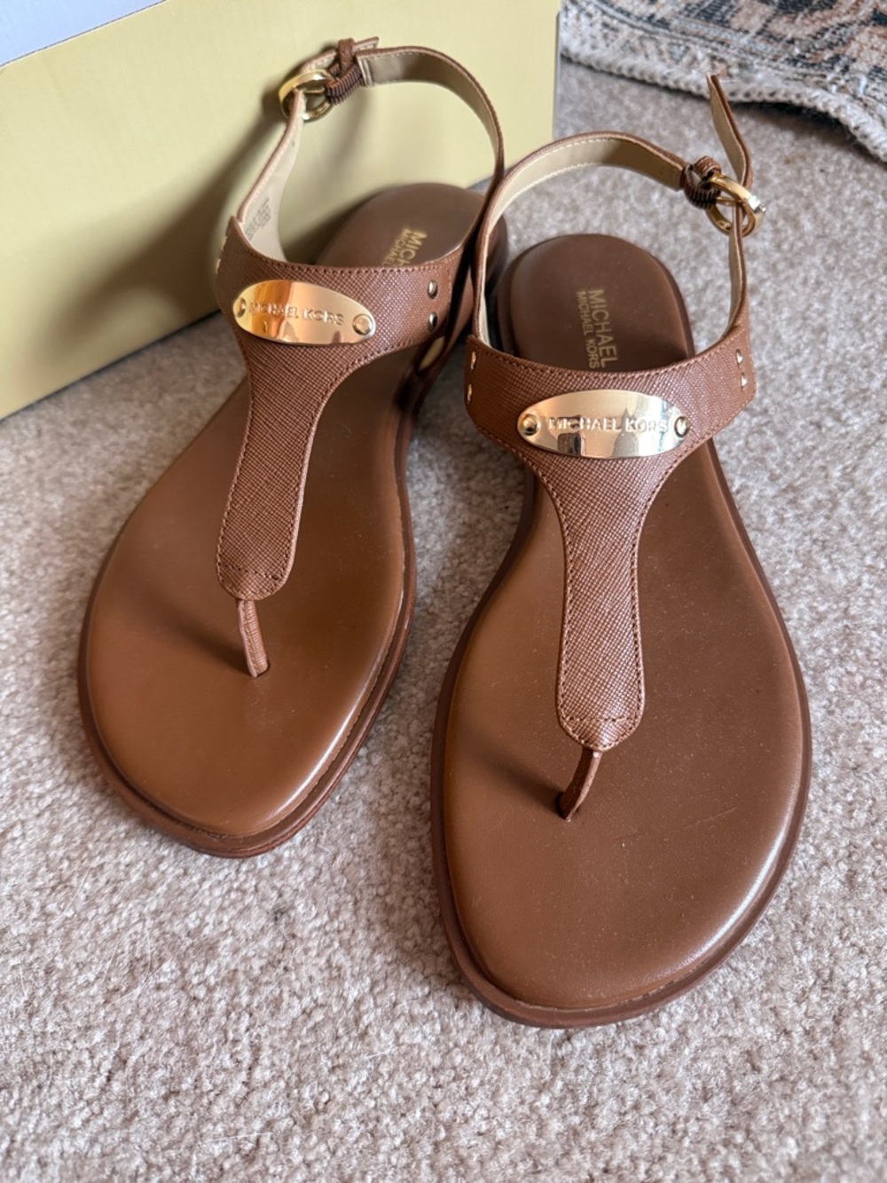 Michael Kors Brown Leather T-Strap Sandals with Gold Plaque